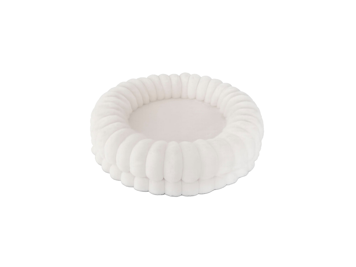 Perro descansando cómodamente sobre la cama Muffin Freedog